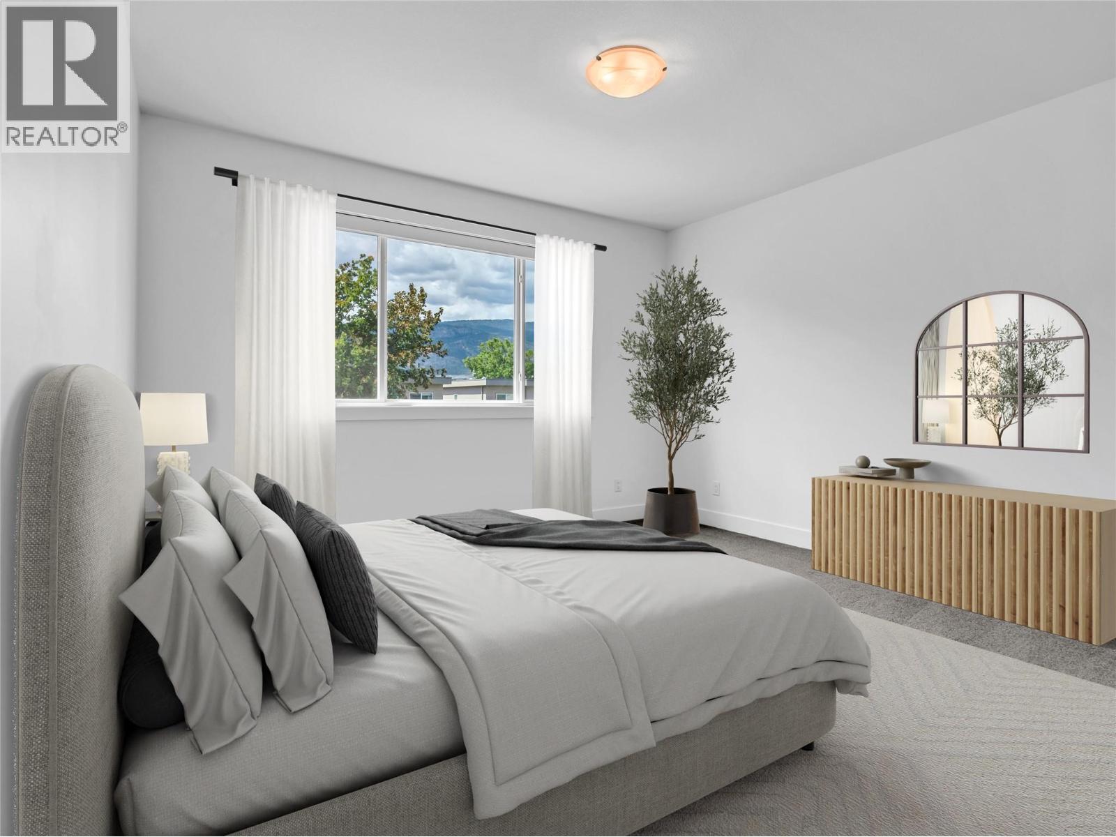 VIRTUALLY STAGED PRIMARY BEDROOM - 453 Maurice Street Unit# 102, Penticton, BC - Indoor Photo Showing Bedroom