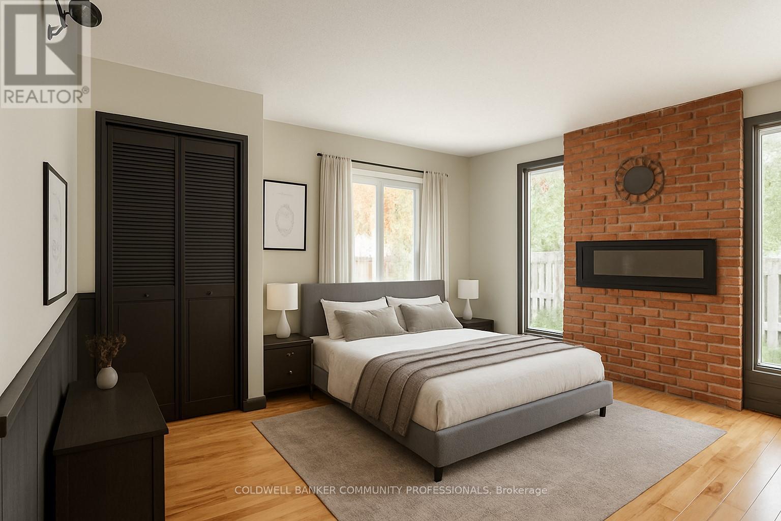 65 Banff Street, Haldimand, ON - Indoor Photo Showing Bedroom With Fireplace