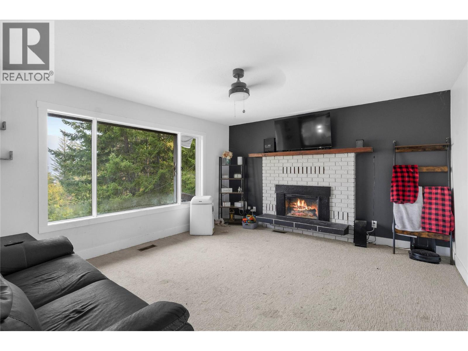 4018 Greaves Road, Eagle Bay, BC - Indoor Photo Showing Living Room With Fireplace