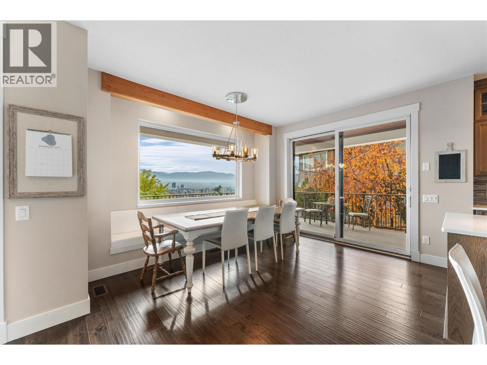 Built-in bench seating and a picture window - 747 Traditions Crescent, Kelowna, BC - Indoor Photo Showing Dining Room