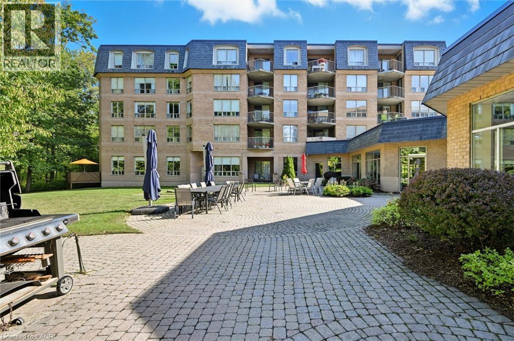 View of home's community featuring a patio area - 8111 Forest Glen Drive Unit# 524, Niagara Falls, ON - Outdoor With Balcony With Facade