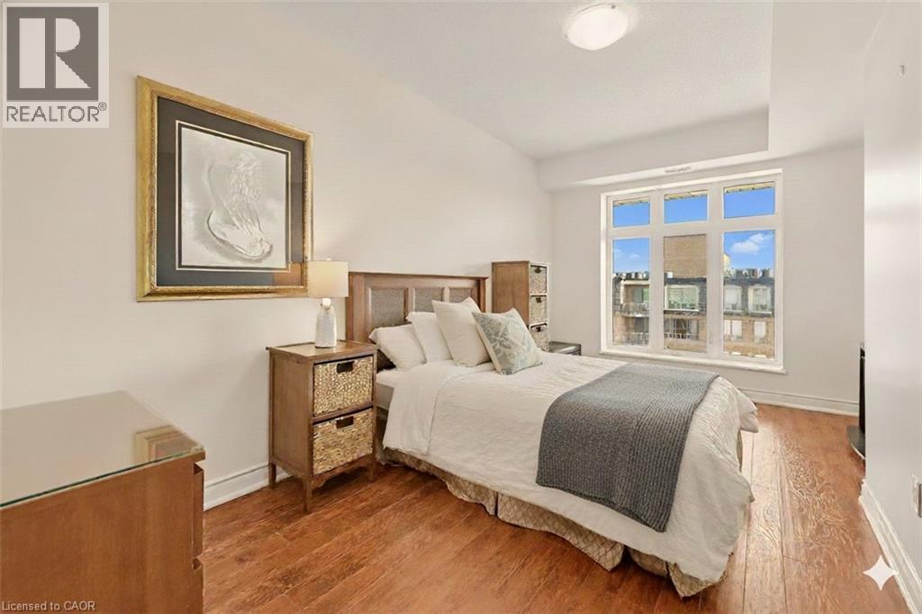 Bedroom featuring wood finished floors - 8111 Forest Glen Drive Unit# 524, Niagara Falls, ON - Indoor Photo Showing Bedroom