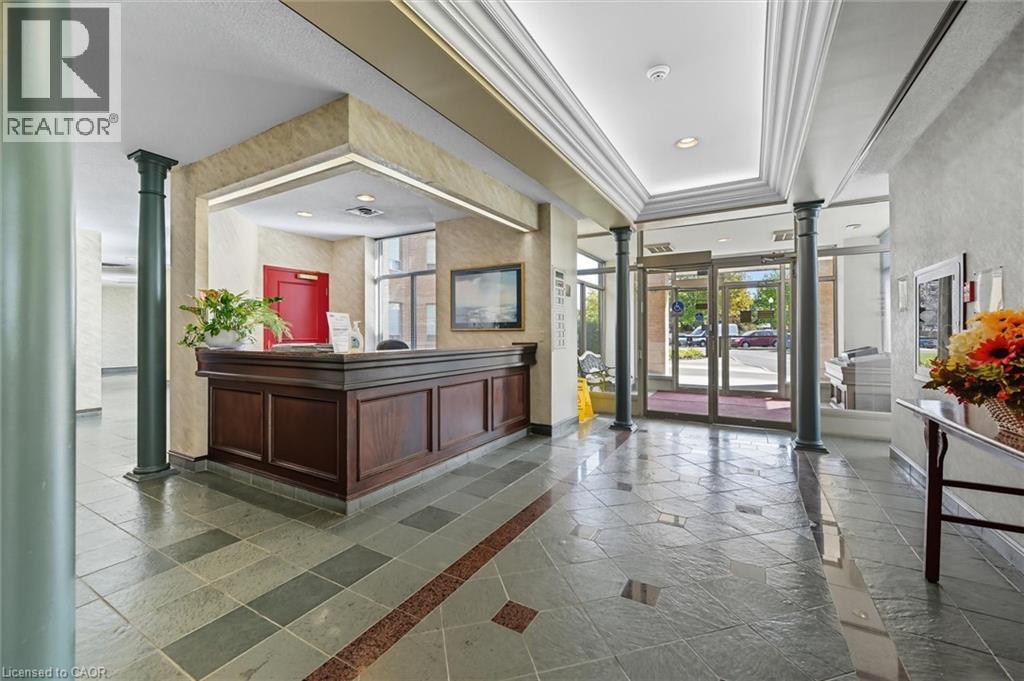 Reception area featuring decorative columns, crown molding, and recessed lighting - 8111 Forest Glen Drive Unit# 524, Niagara Falls, ON - Indoor Photo Showing Other Room