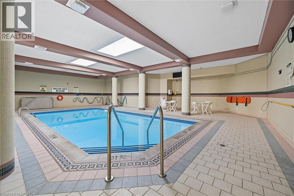 Indoor pool featuring a skylight - 8111 Forest Glen Drive Unit# 524, Niagara Falls, ON - Indoor Photo Showing Other Room With In Ground Pool
