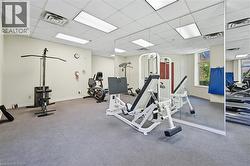Workout area with a paneled ceiling -