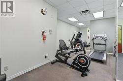 Workout area featuring a paneled ceiling -