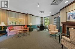 Lobby featuring wallpapered walls, ornamental molding, and recessed lighting -