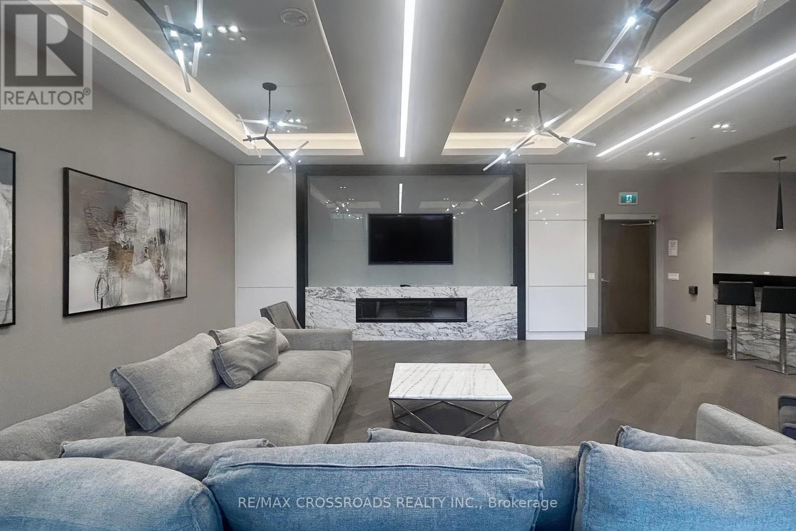 823 - 99 Eagle Rock Way, Vaughan, ON - Indoor Photo Showing Living Room With Fireplace