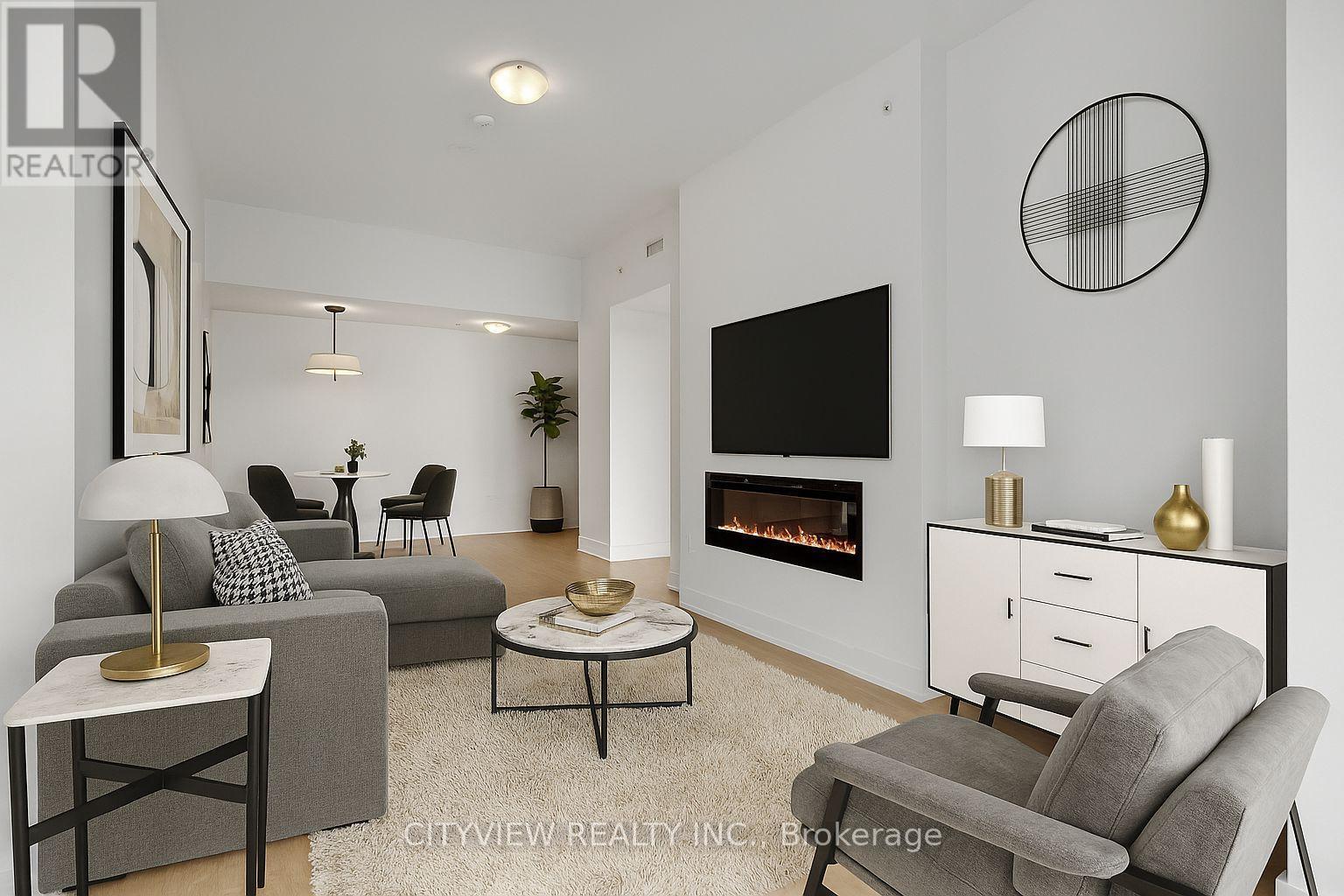 4510 - 20 Shore Breeze Drive, Toronto, ON - Indoor Photo Showing Living Room With Fireplace