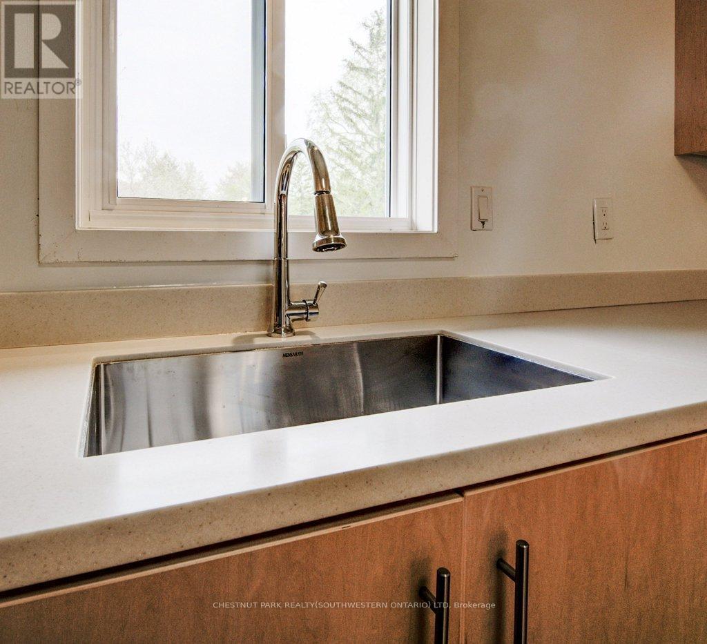 6998 St. Patrick Street, West Perth, ON - Indoor Photo Showing Kitchen With Double Sink