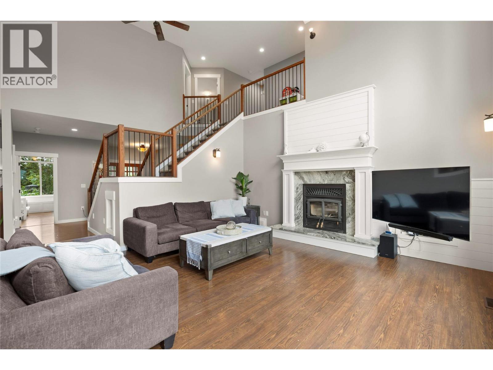 4322 Sharp Road, Spallumcheen, BC - Indoor Photo Showing Living Room With Fireplace
