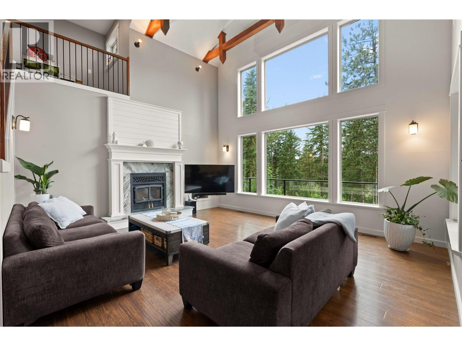 4322 Sharp Road, Spallumcheen, BC - Indoor Photo Showing Living Room With Fireplace