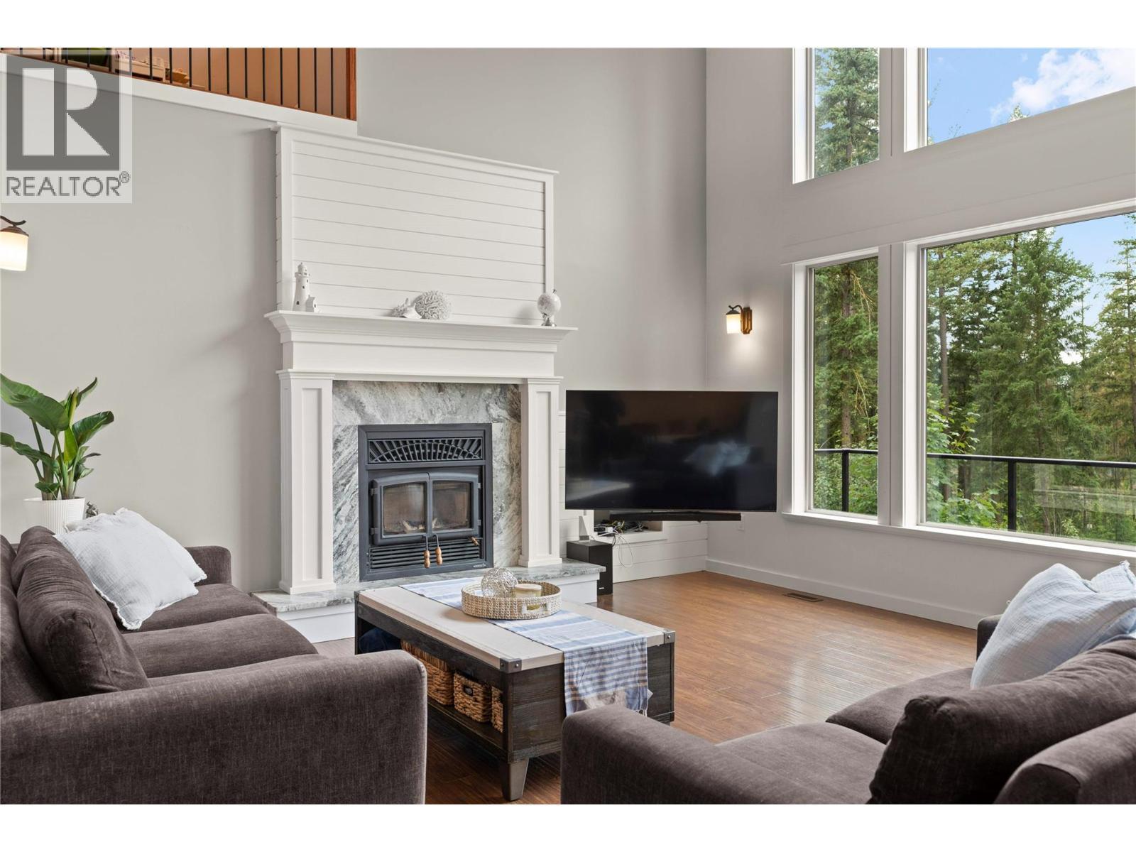 4322 Sharp Road, Spallumcheen, BC - Indoor Photo Showing Living Room With Fireplace