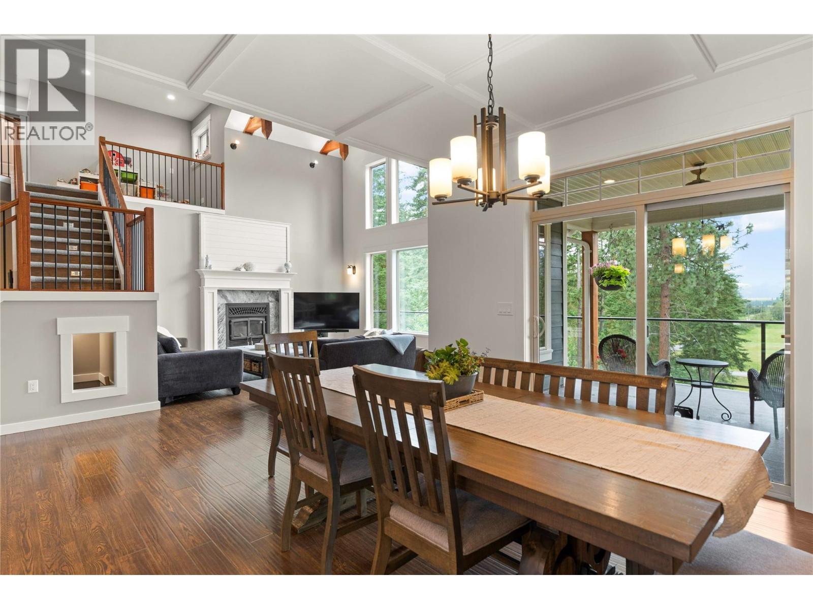 4322 Sharp Road, Spallumcheen, BC - Indoor Photo Showing Dining Room With Fireplace