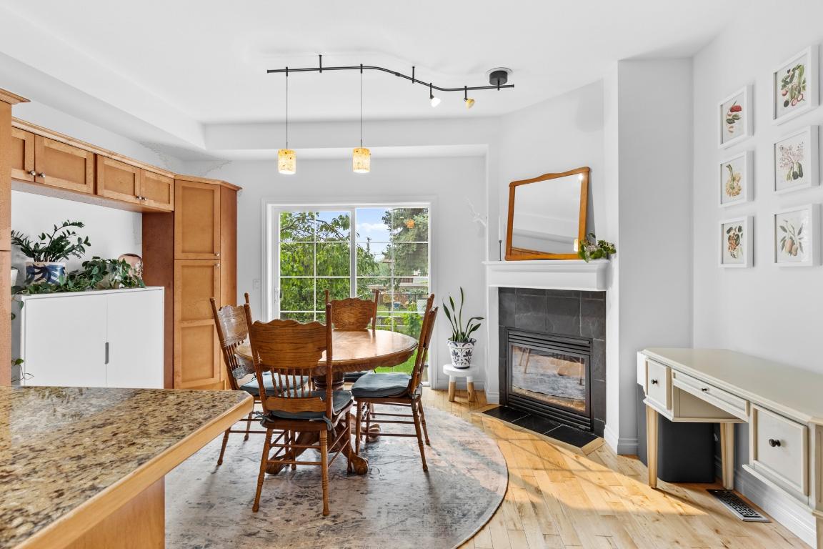 124-456 Mcphee Street, Kelowna, BC - Indoor Photo Showing Dining Room With Fireplace