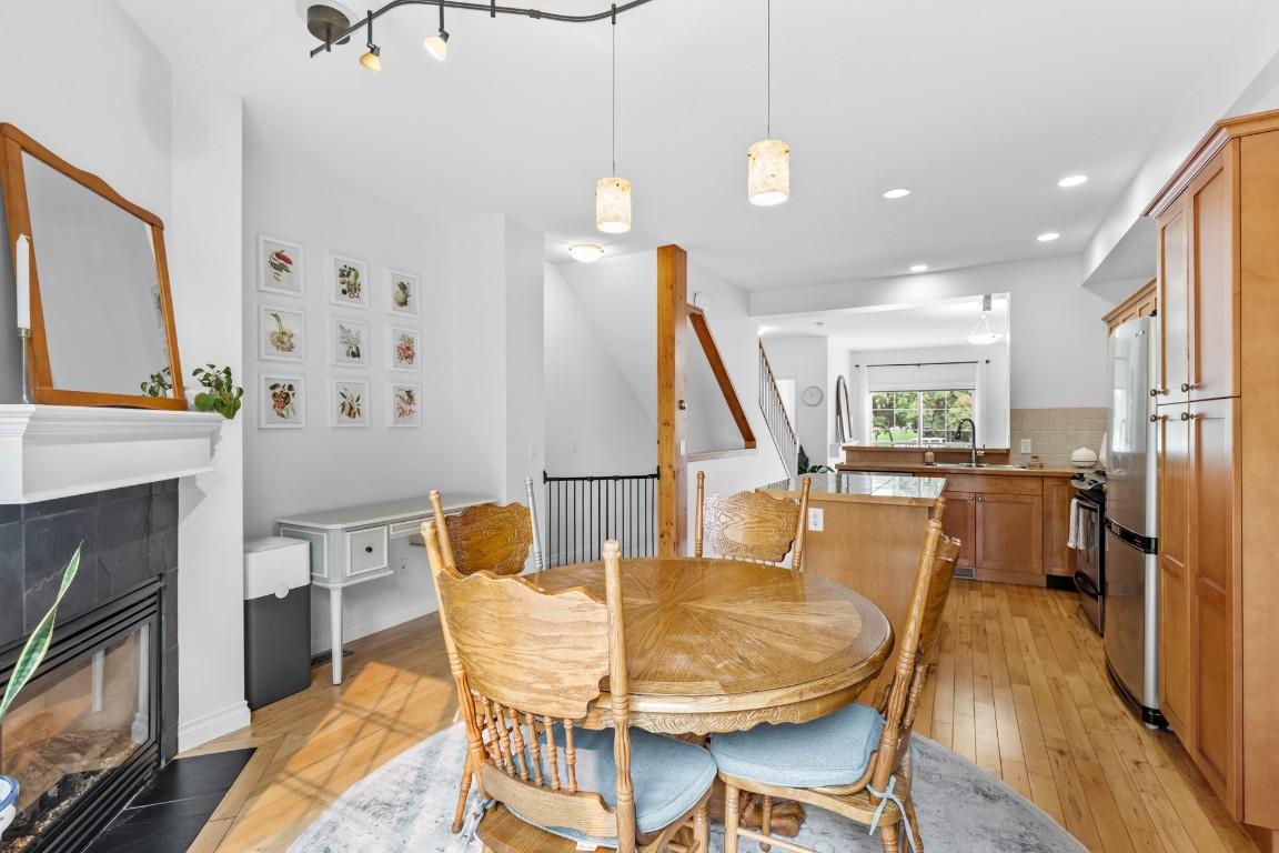 124-456 Mcphee Street, Kelowna, BC - Indoor Photo Showing Dining Room With Fireplace