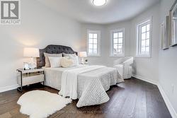 2nd BR with wood flooring, big windows & closet -