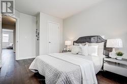 2nd BR with wood flooring, big windows & closet -