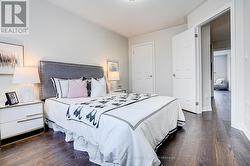 3rd bedroom with wood flooring, windows, closet -