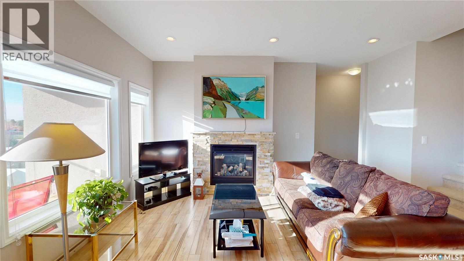 242 Whalley Crescent, Saskatoon, SK - Indoor Photo Showing Living Room With Fireplace