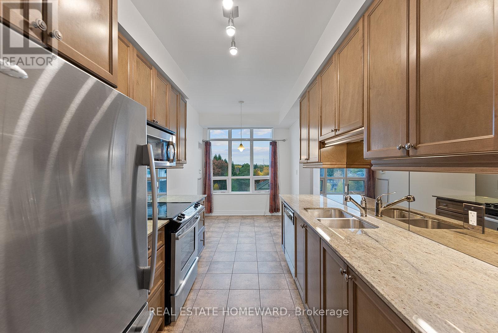 714 - 10 Bloorview Place, Toronto, ON - Indoor Photo Showing Kitchen With Double Sink