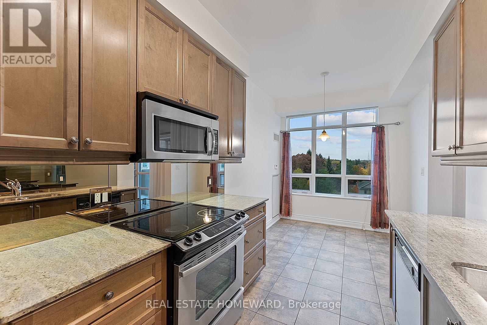 714 - 10 Bloorview Place, Toronto, ON - Indoor Photo Showing Kitchen With Upgraded Kitchen