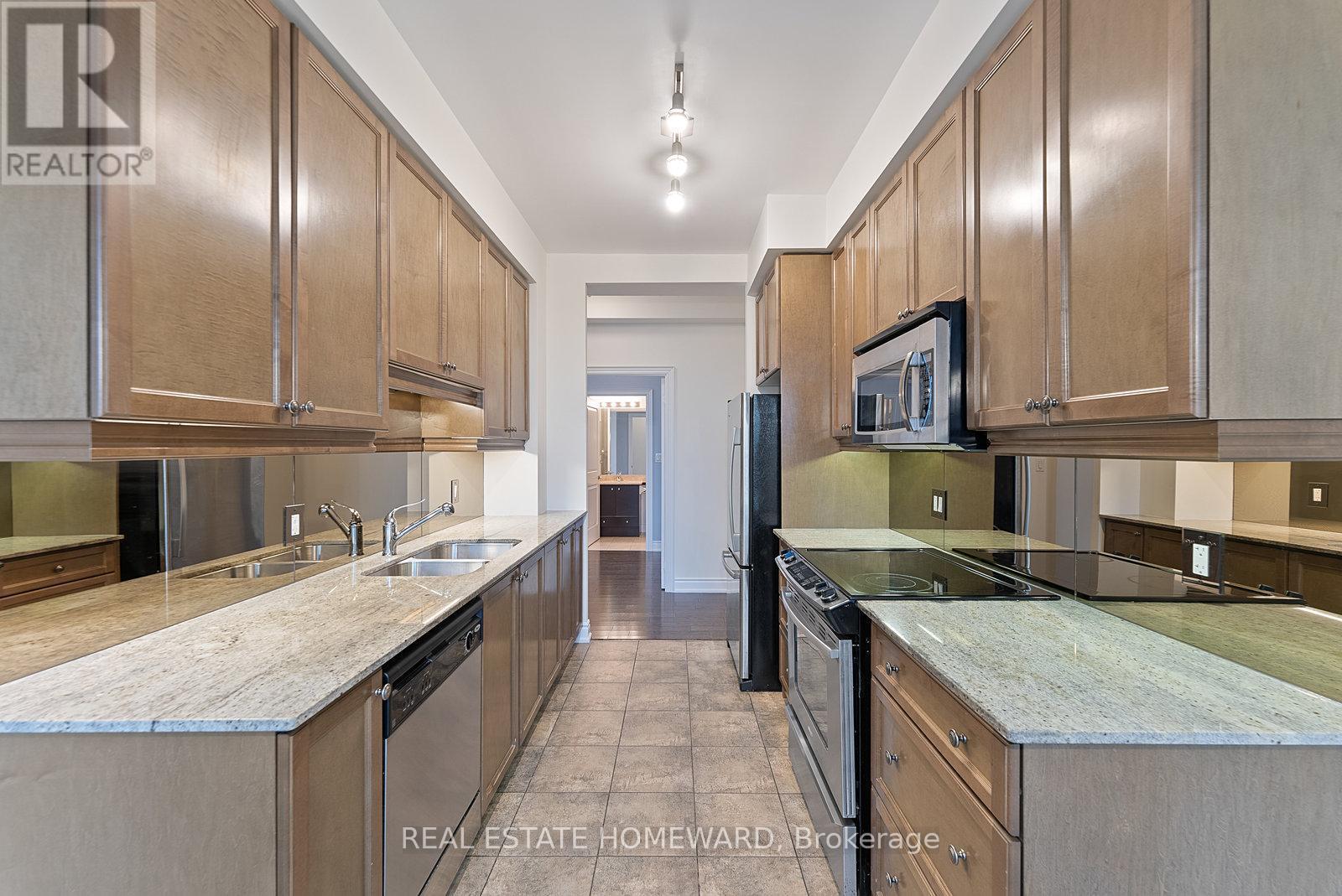 714 - 10 Bloorview Place, Toronto, ON - Indoor Photo Showing Kitchen With Double Sink With Upgraded Kitchen