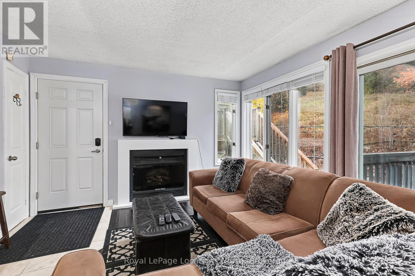 805 - 796468 Grey 19 Road, Blue Mountains, ON - Indoor Photo Showing Living Room With Fireplace