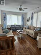 Sunny room accessible through sunroom. -