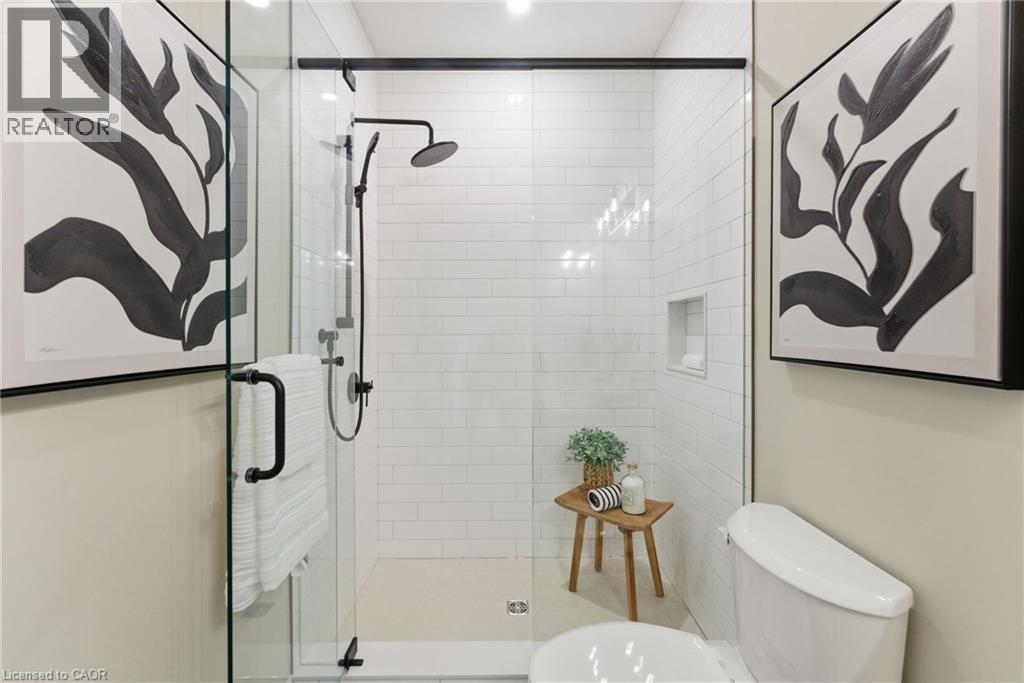 Full bath featuring toilet and a shower stall - 29 Weymouth Street Unit# 25, Elmira, ON - Indoor Photo Showing Bathroom