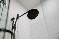 Bathroom view of a tile shower -