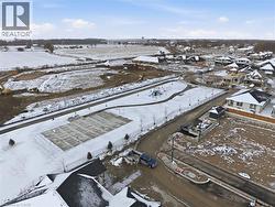 Snowy aerial view featuring a residential view -