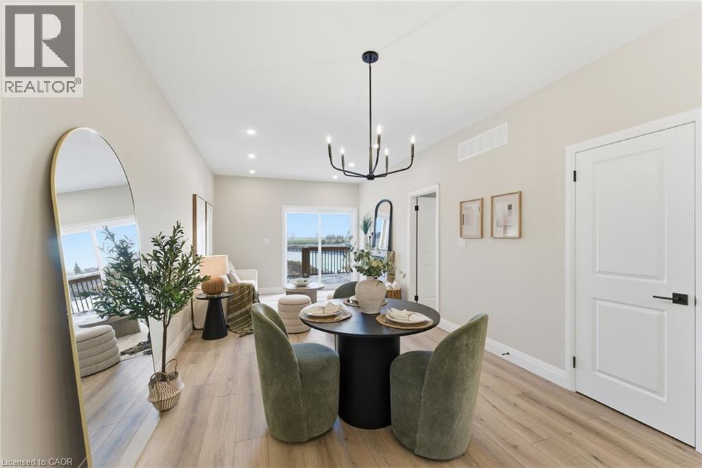Dining area with light wood finished floors, recessed lighting, and a chandelier - 29 Weymouth Street Unit# 17, Elmira, ON - Indoor Photo Showing Dining Room