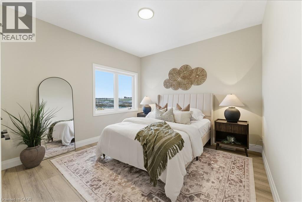 Bedroom featuring light wood-style floors - 29 Weymouth Street Unit# 17, Elmira, ON - Indoor Photo Showing Bedroom