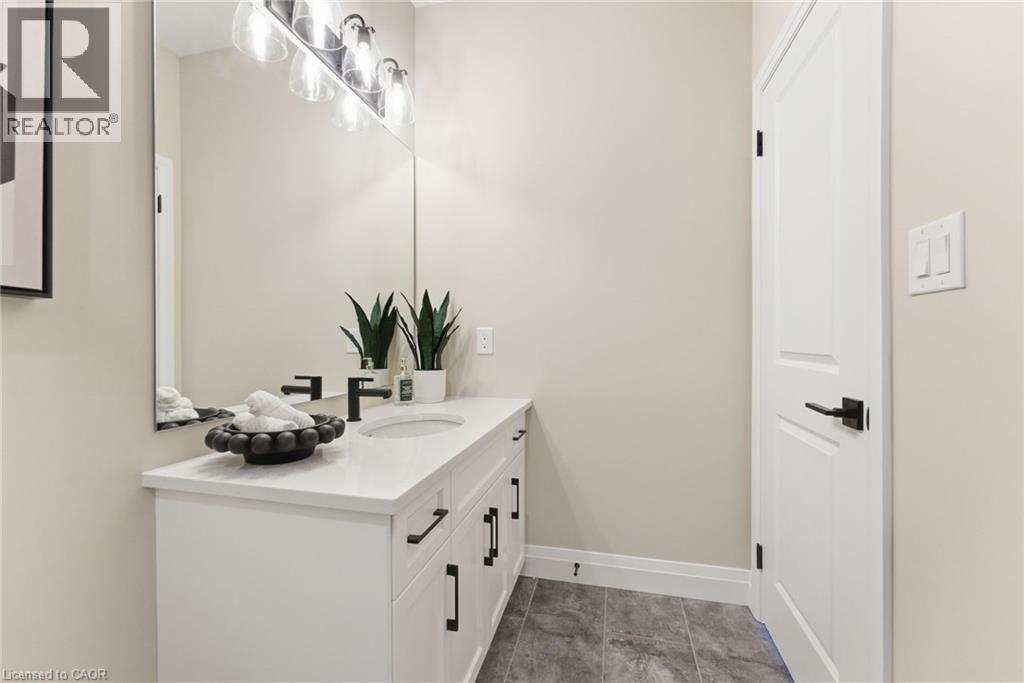 Bathroom with vanity and light tile patterned flooring - 29 Weymouth Street Unit# 17, Elmira, ON - Indoor Photo Showing Bathroom