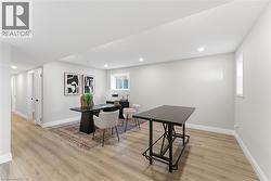 Dining area featuring light wood-style flooring and recessed lighting -