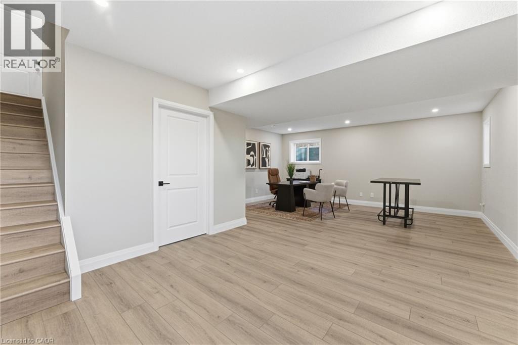 Living area featuring stairs, light wood-style floors, and recessed lighting - 29 Weymouth Street Unit# 17, Elmira, ON - Indoor Photo Showing Other Room