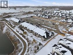 Aerial view of property's location featuring nearby suburban area -