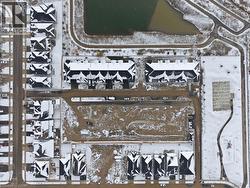 Aerial view of property's location featuring nearby suburban area -