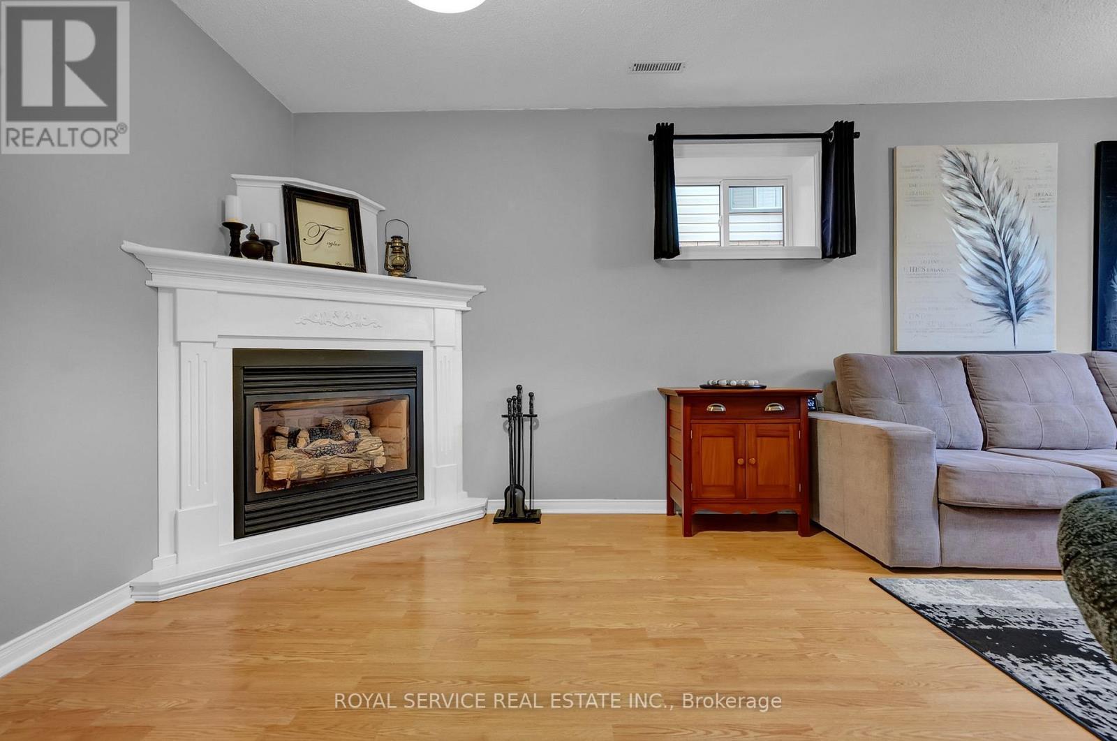 6 Goodwin Avenue, Clarington (Bowmanville), ON - Indoor Photo Showing Living Room With Fireplace