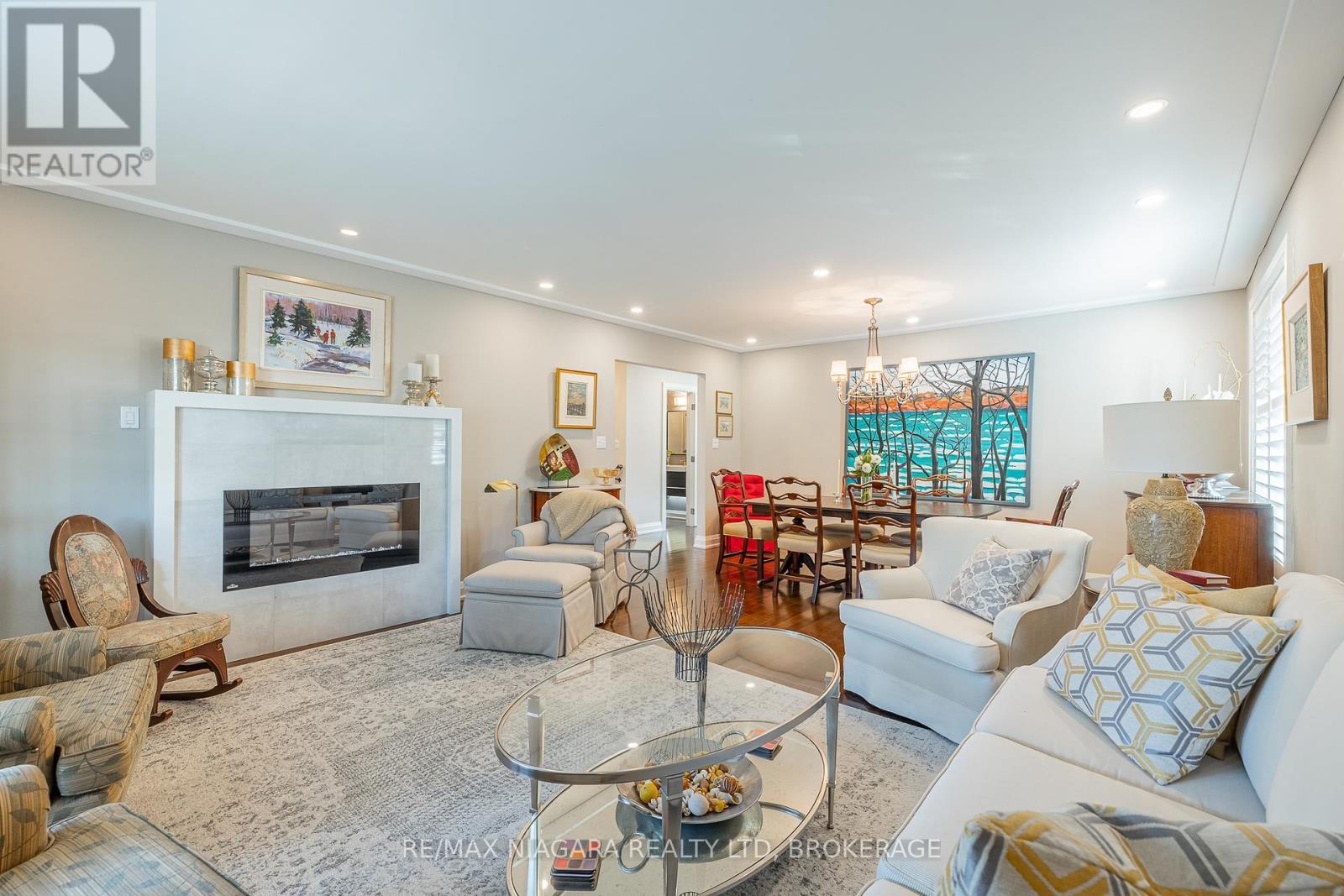 Living Room / Dining Room Space - 21 - 141 Welland Vale Road, St. Catharines (Grapeview), ON - Indoor Photo Showing Living Room With Fireplace