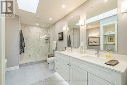Double Vanity with Under Lighting & Skylight -