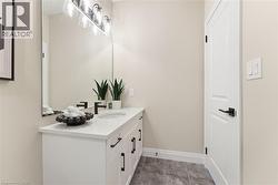 Bathroom with vanity and light tile patterned flooring -