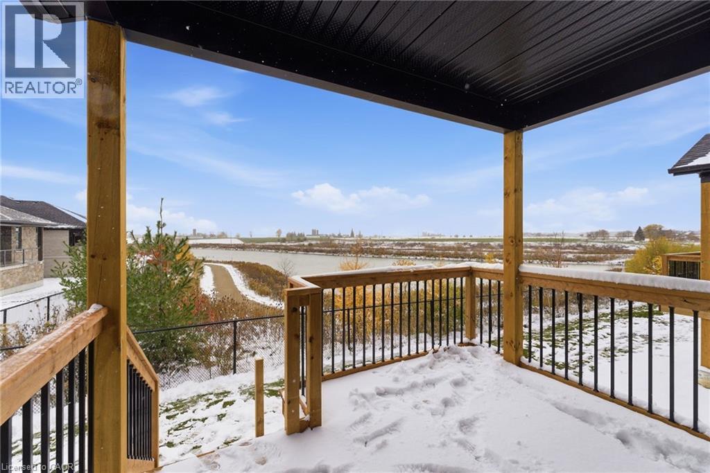 View of snow covered deck - 29 Weymouth Street Unit# 18, Elmira, ON - Outdoor With Exterior
