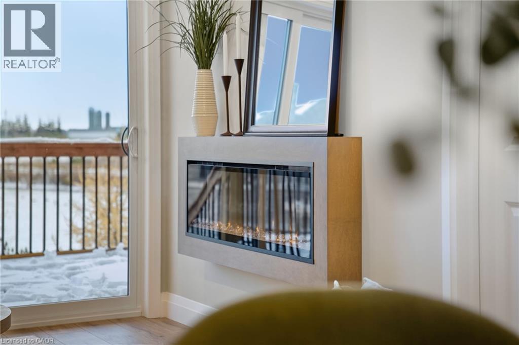 Detailed view of wood finished floors and baseboards - 29 Weymouth Street Unit# 18, Elmira, ON - Indoor Photo Showing Other Room
