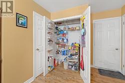 Pantry in kitchen, door to garage on right side -