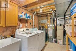 Laundry/utility room in basement. -