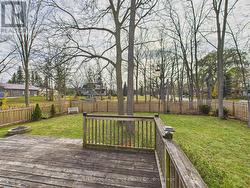 Large deck overlooking spacious backyard -