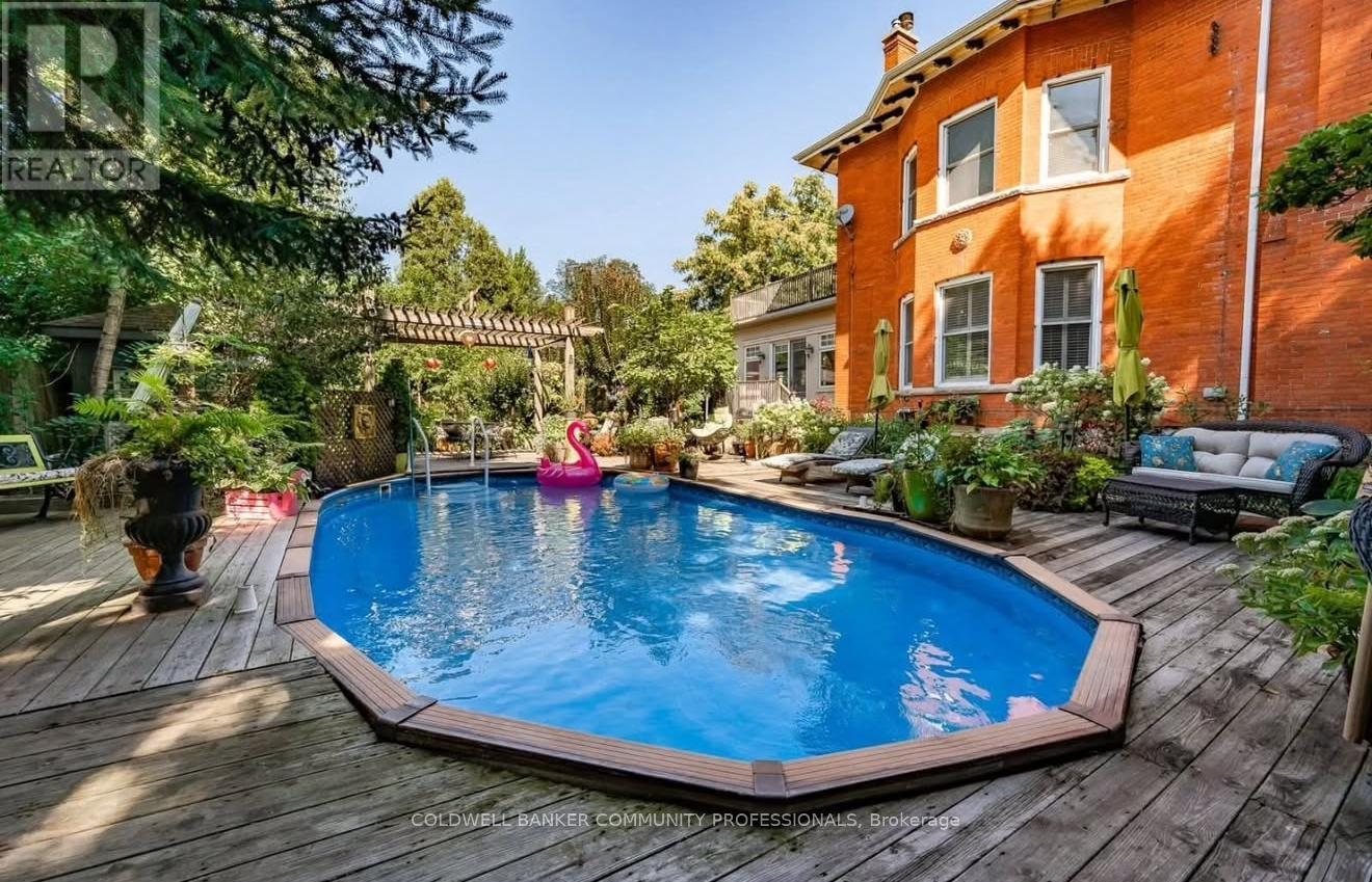 Photo taken in 2019. - 34 Holton Avenue S, Hamilton, ON - Outdoor With Above Ground Pool With Deck Patio Veranda