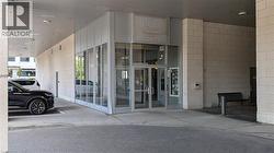 Doorway to property featuring concrete block siding -